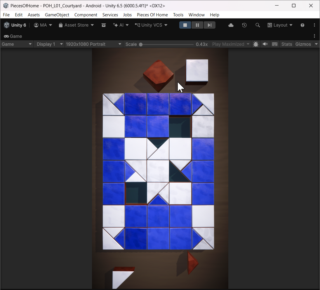 Early Unity gameplay development showing a blue and white mosaic with missing tiles and loose pieces